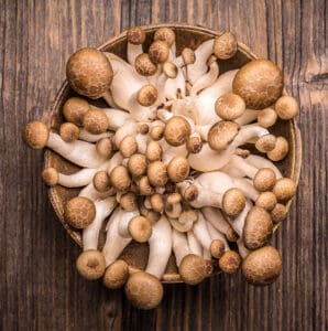 Big bowl of brown mushrooms on a table